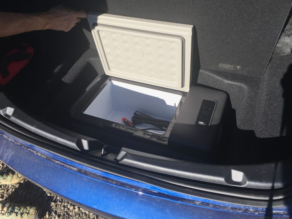 ACOPOWER P15 fridge in the trunk of a Tesla Model 3.